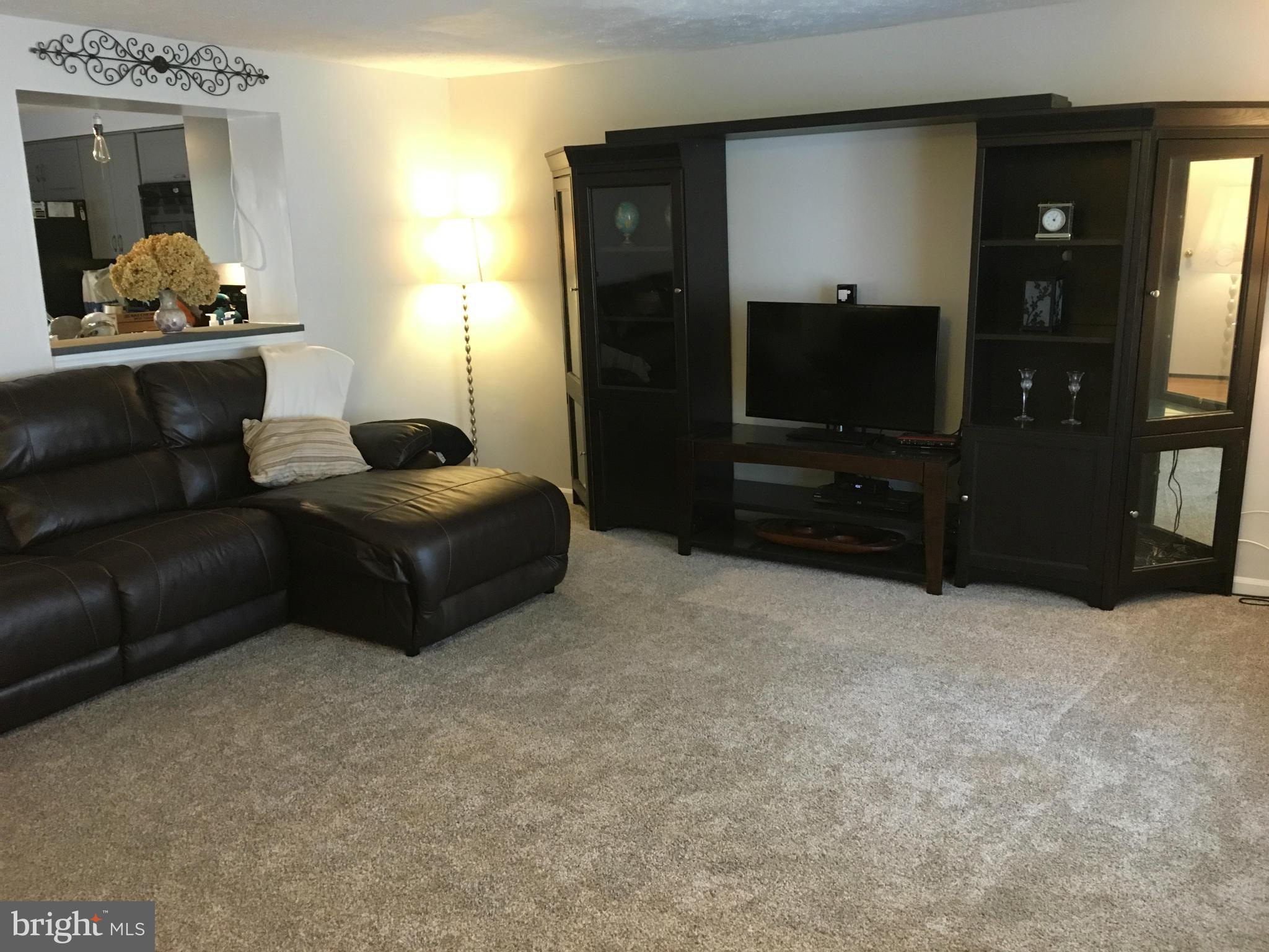 5023 Clifford Road Perry Hall, MD 21128 - Photo 6 of 28 a living room with furniture and a flat screen tv