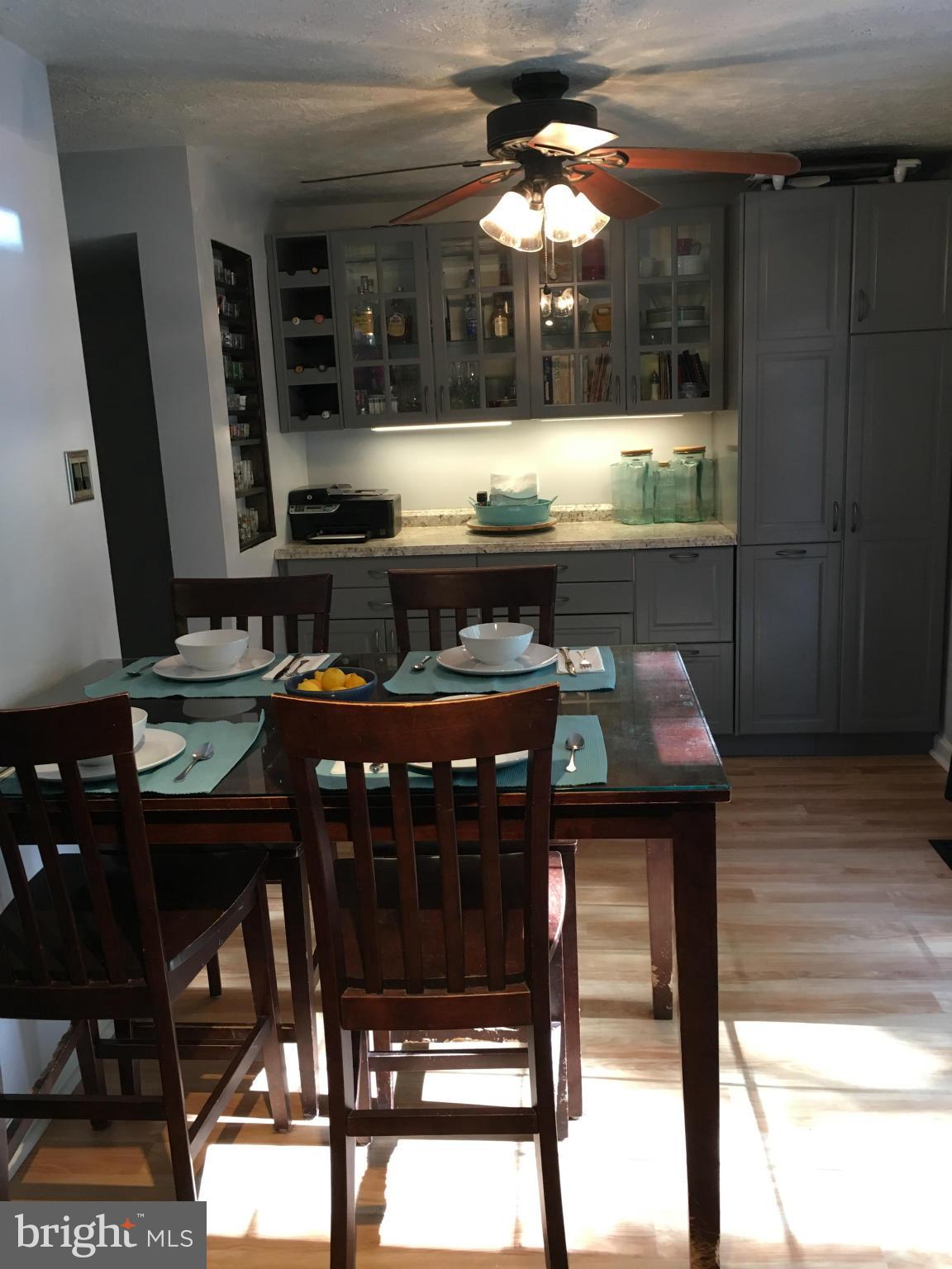 5023 Clifford Road Perry Hall, MD 21128 - Photo 9 of 28 a kitchen with a table chairs and a stove