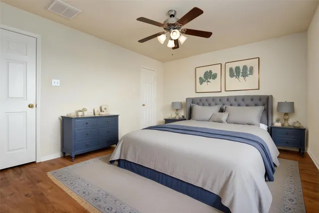 a bedroom with a bed and a dresser