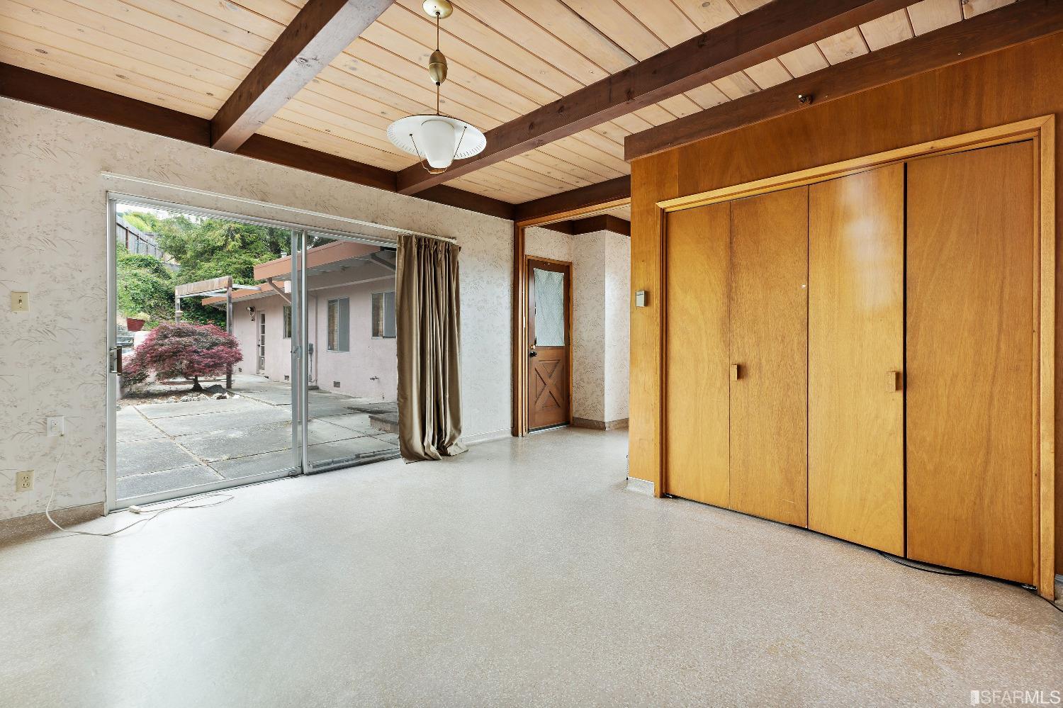1773 Walnut Street El Cerrito, CA 94530 - Photo 16 of 43 a view of a hallway with a glass door and furniture