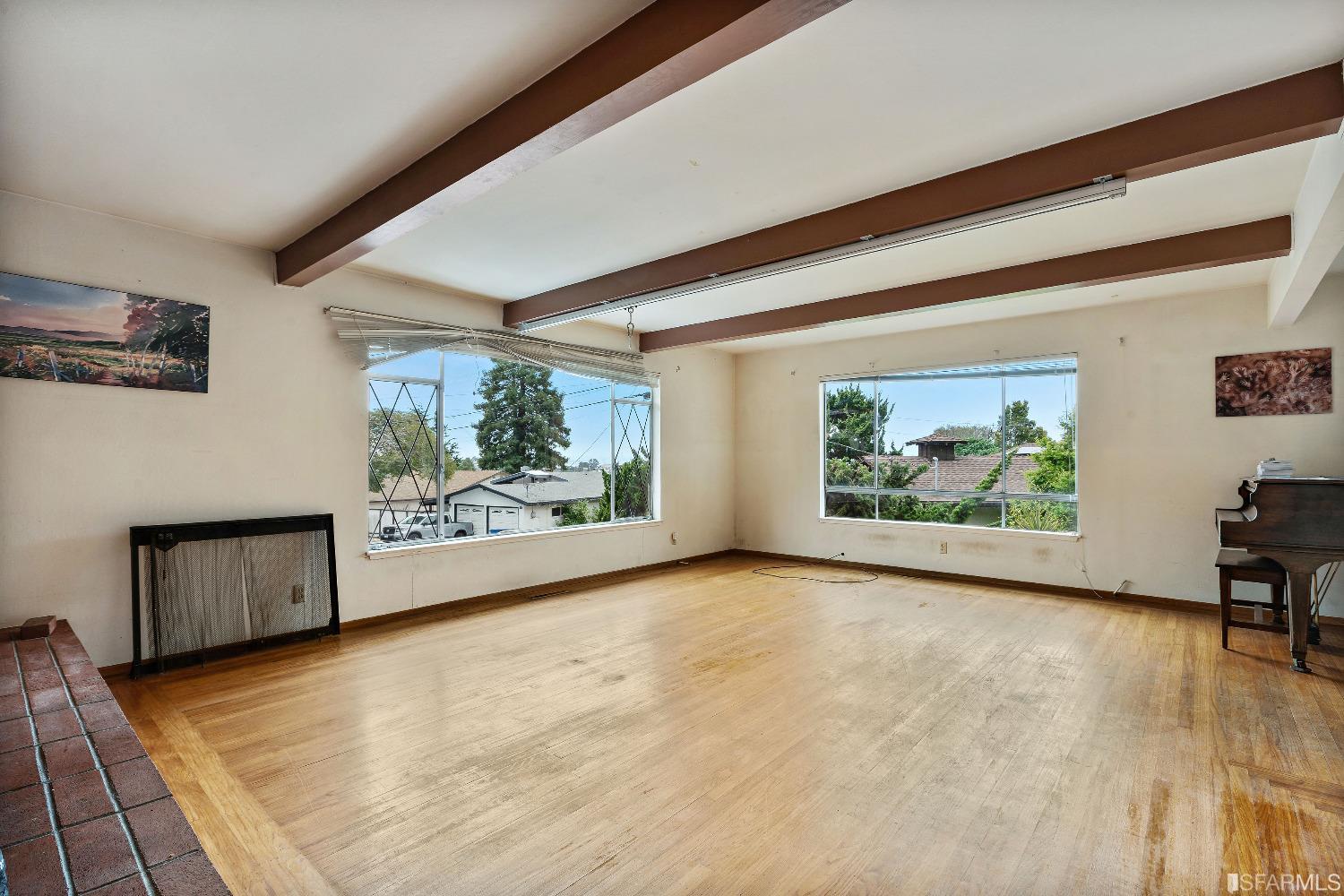 1773 Walnut Street El Cerrito, CA 94530 - Photo 2 of 43 a view of an empty room with window and kitchen area