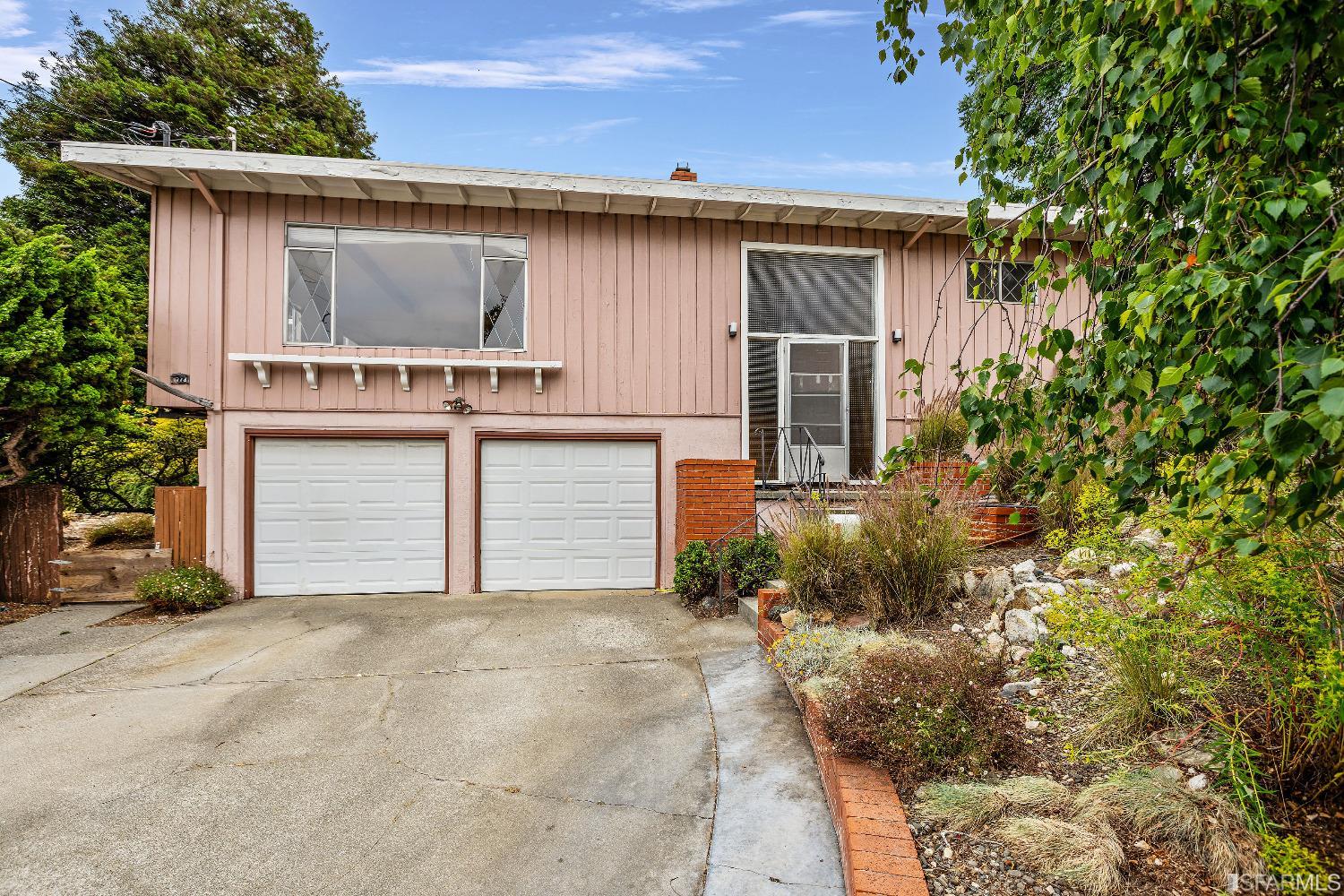 1773 Walnut Street El Cerrito, CA 94530 - Photo 39 of 43 a front view of a house with a yard and garage