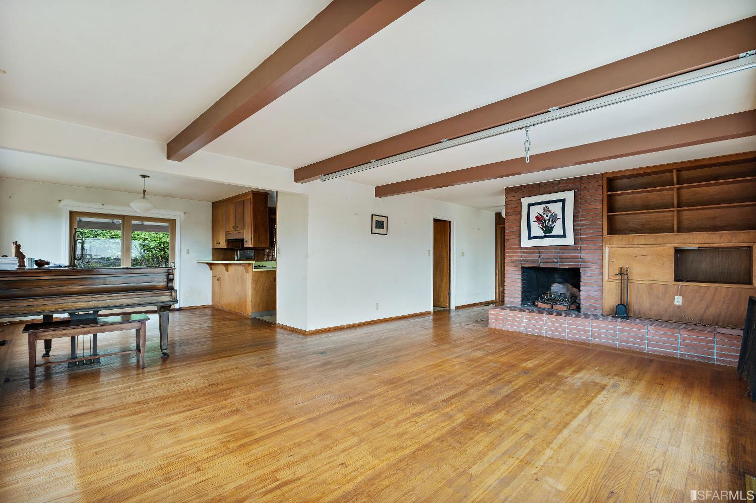 1773 Walnut Street El Cerrito, CA 94530 - Photo 4 of 43 a view of a livingroom with furniture a fireplace and wooden floor