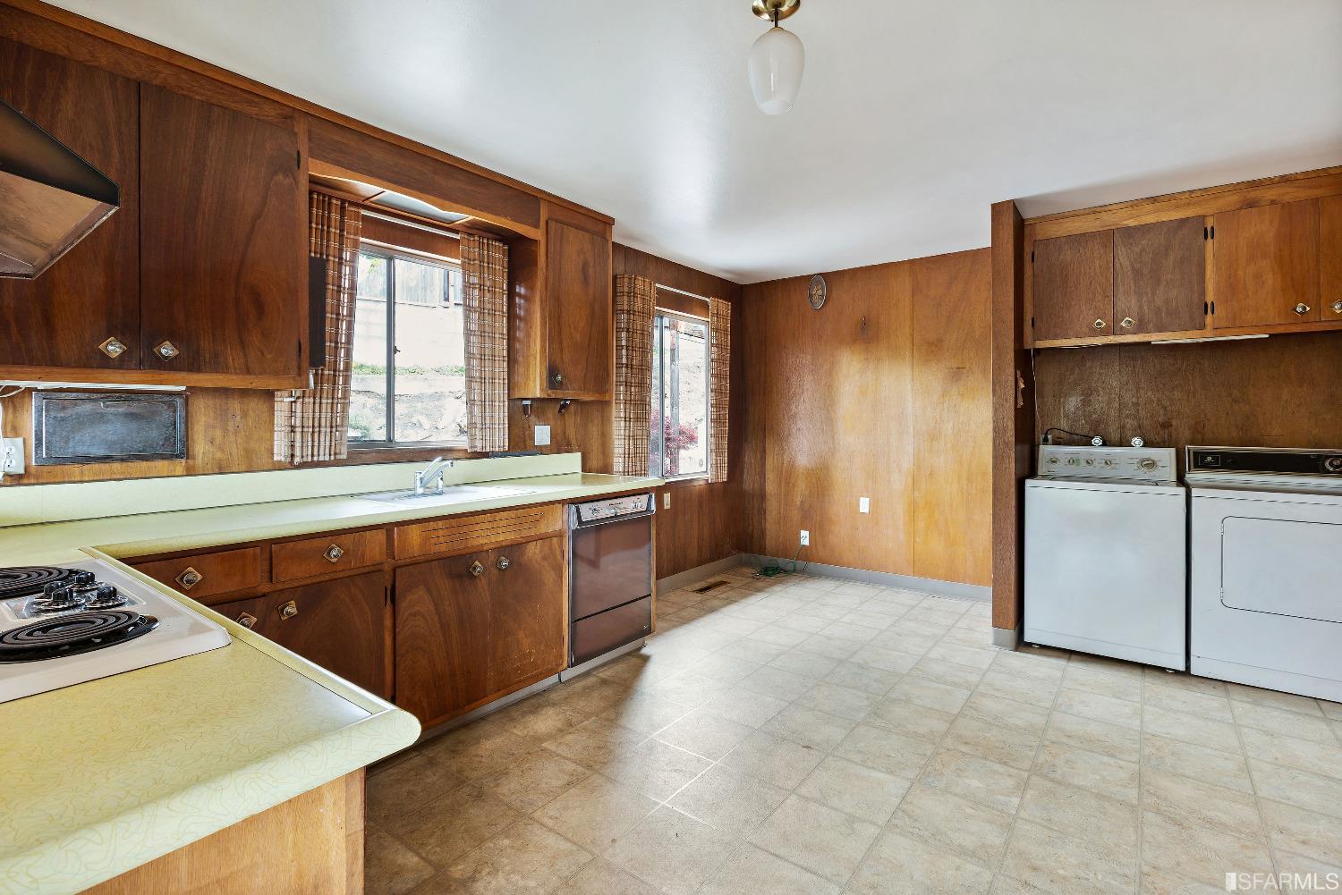 1773 Walnut Street El Cerrito, CA 94530 - Photo 7 of 43 a kitchen with stainless steel appliances granite countertop a stove a sink and a refrigerator