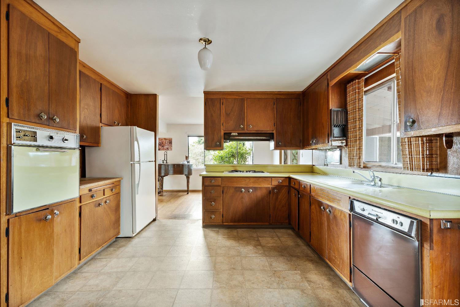1773 Walnut Street El Cerrito, CA 94530 - Photo 9 of 43 a kitchen with stainless steel appliances granite countertop a refrigerator a sink dishwasher stove and oven