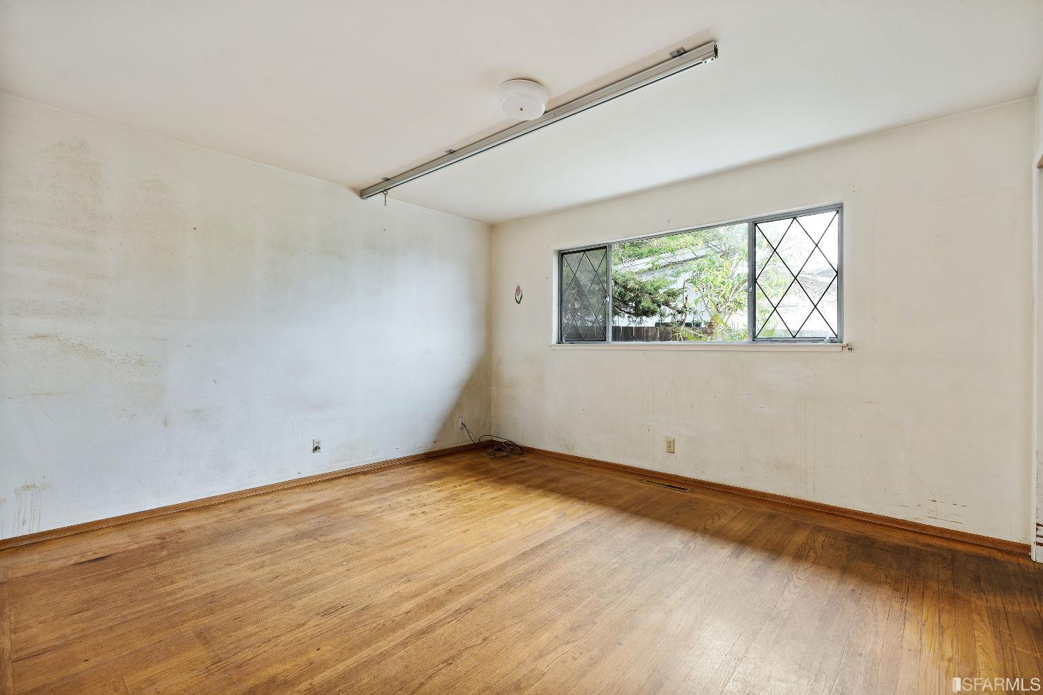 1773 Walnut Street El Cerrito, CA 94530 - Photo 10 of 43 an empty room with windows