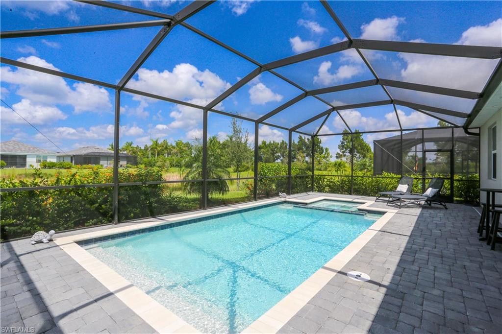 2155 Hamlin Street Naples, FL 34120 - Photo 10 of 50 View of swimming pool featuring a patio and a lanai