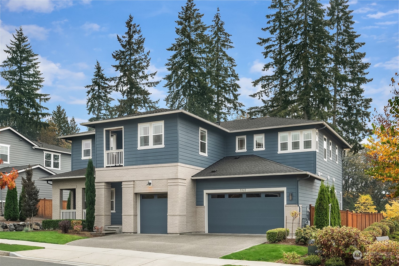 3322 219th Place Southeast Bothell, WA 98021 - Photo 1 of 37 a front view of a house with a garden and trees