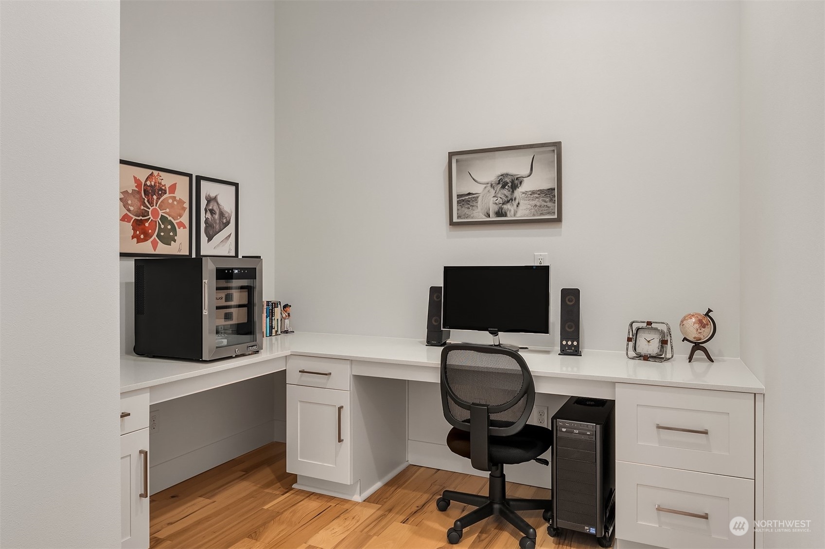 3322 219th Place Southeast Bothell, WA 98021 - Photo 15 of 37 a view of a workspace with furniture and wooden floor