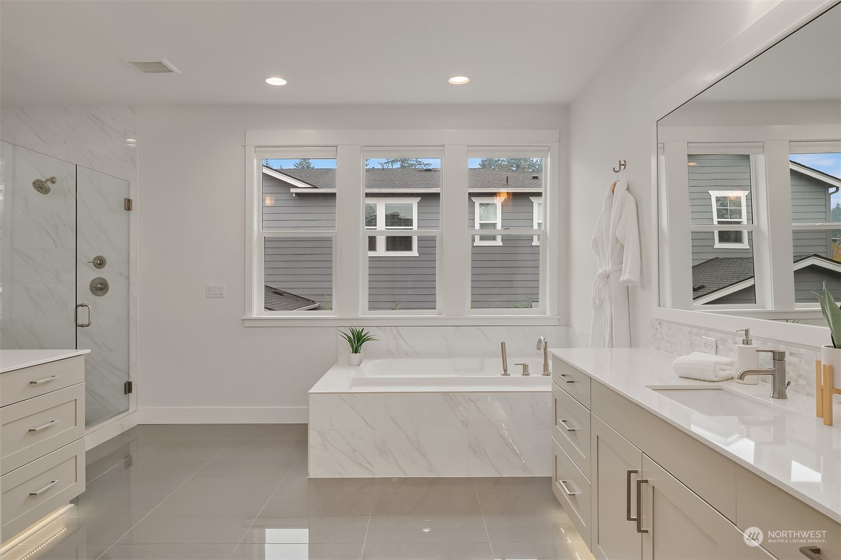 3322 219th Place Southeast Bothell, WA 98021 - Photo 25 of 37 a spacious bathroom with a granite countertop tub sink and mirror