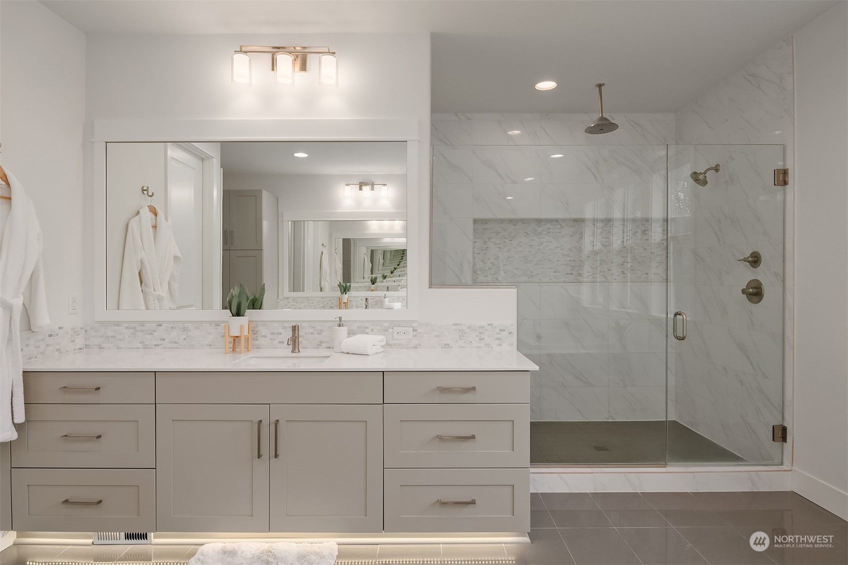 3322 219th Place Southeast Bothell, WA 98021 - Photo 26 of 37 a bathroom with a shower sink and mirror
