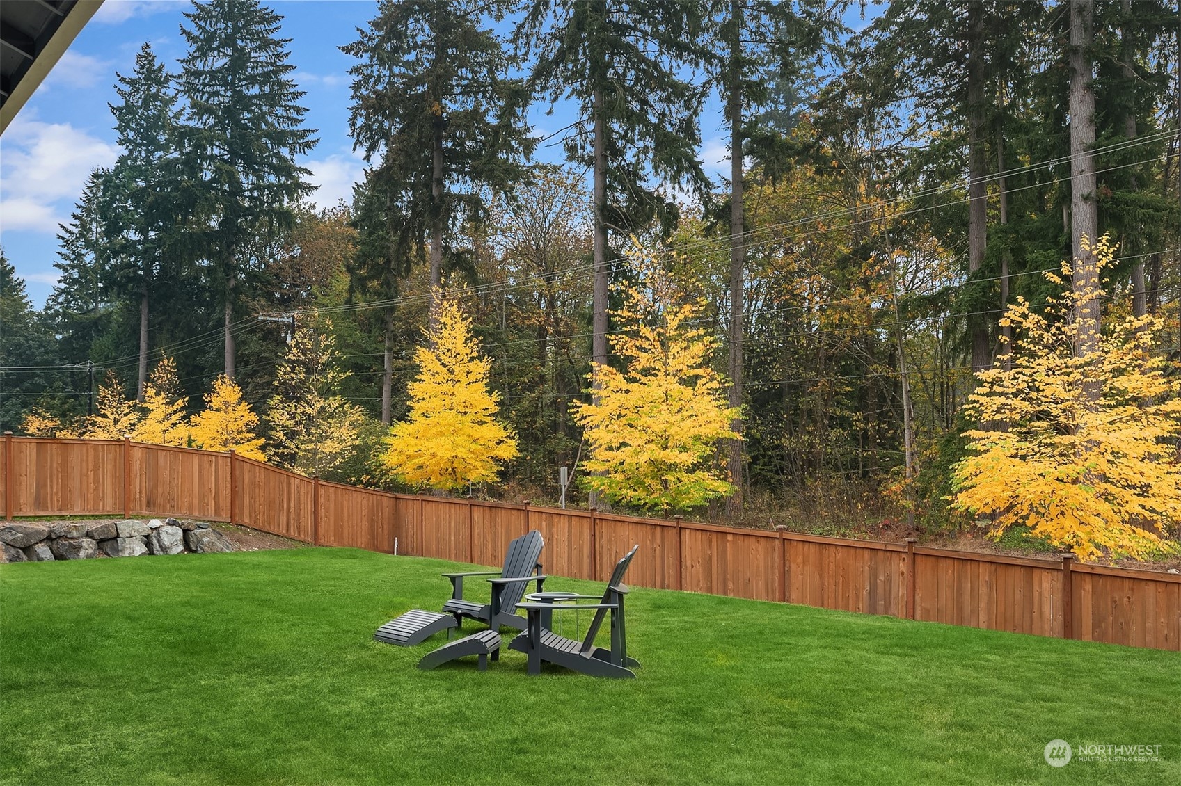 3322 219th Place Southeast Bothell, WA 98021 - Photo 34 of 37 a view of a backyard with wooden fence