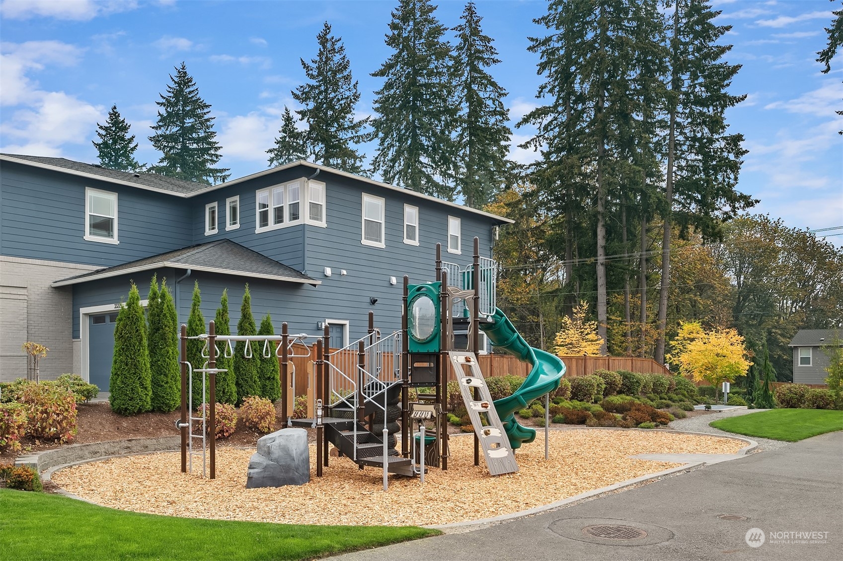 3322 219th Place Southeast Bothell, WA 98021 - Photo 36 of 37 a front view of a house with garden