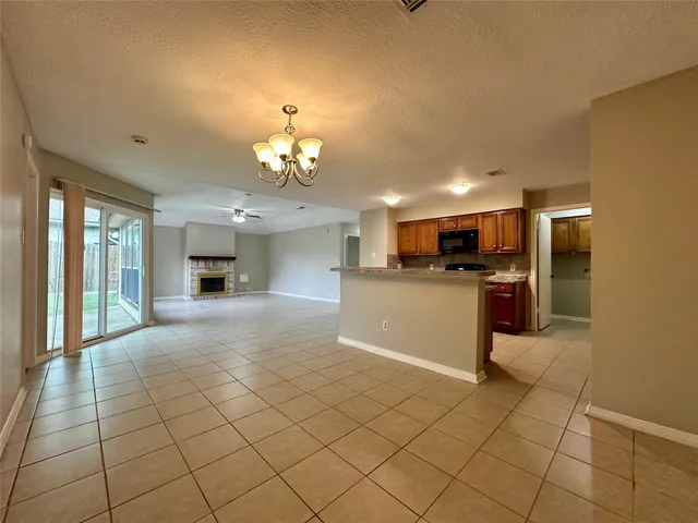 a large kitchen with cabinets and stainless steel appliances