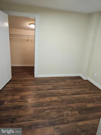 a view of room with wooden floor