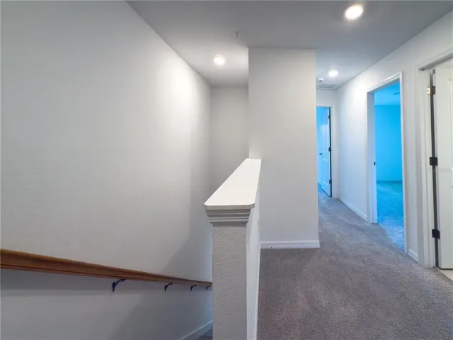 an aerial view of house with yard swimming pool and ocean view