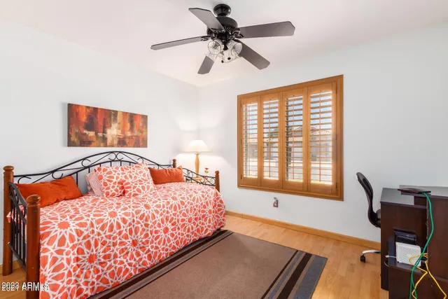 a bedroom with a bed and window