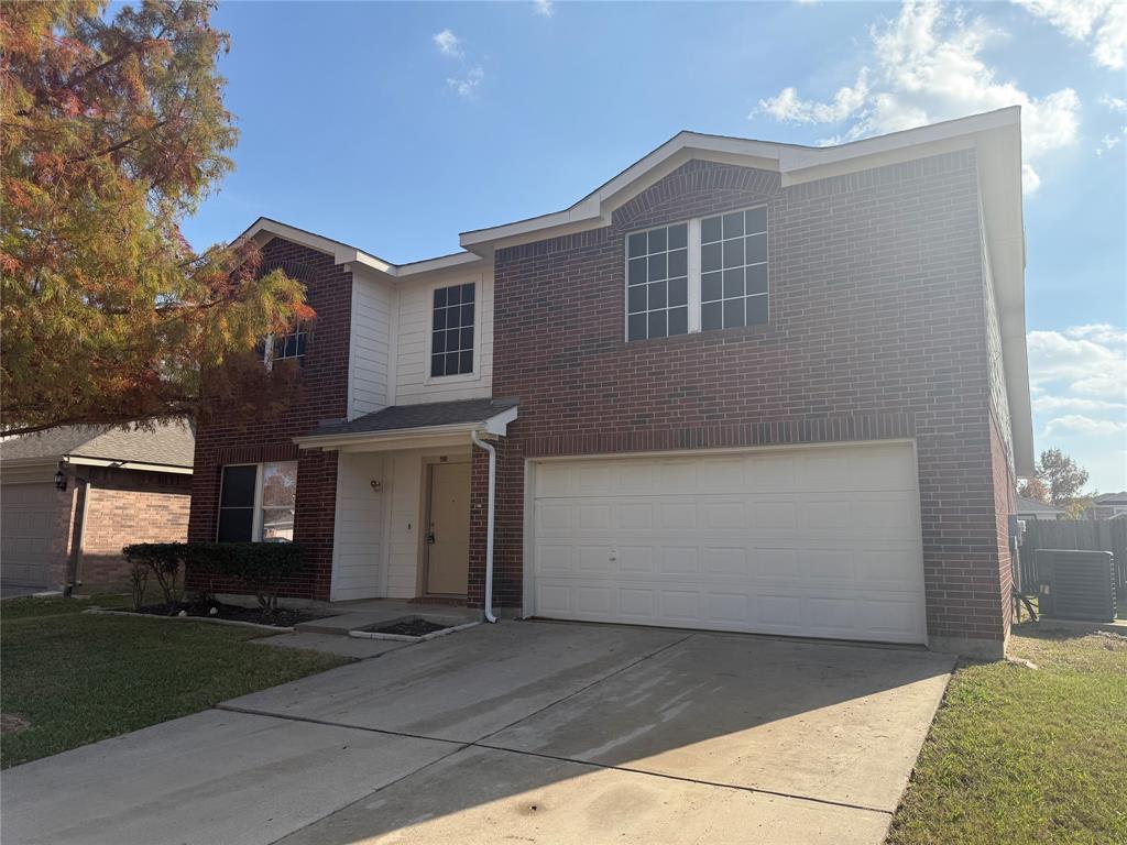 4116 Majestic Court Fort Worth, TX 76244 - Photo 2 of 37 a front view of a house with a yard and garage