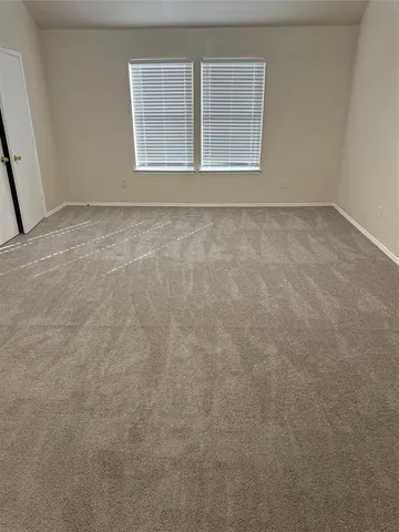 a white bath tub sitting next to a shower