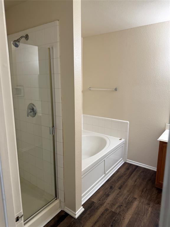 4116 Majestic Court Fort Worth, TX 76244 - Photo 22 of 37 a white bath tub sitting next to a shower