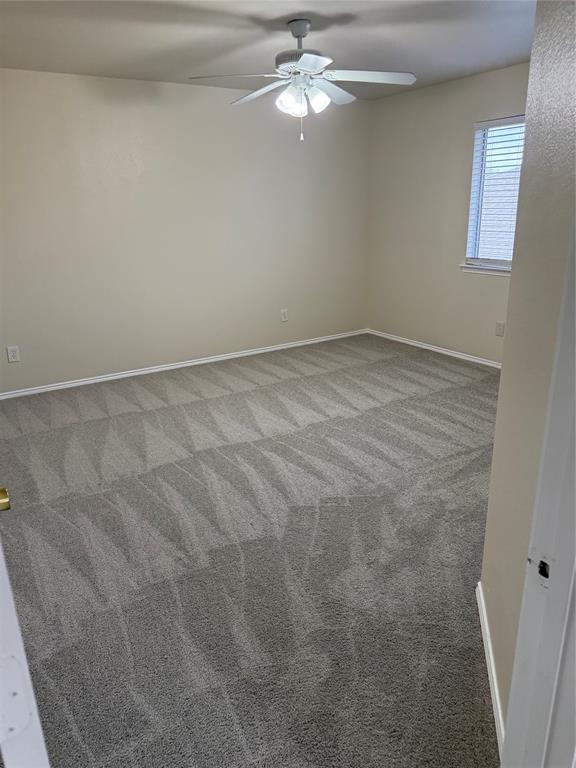4116 Majestic Court Fort Worth, TX 76244 - Photo 27 of 37 an empty room with a chandelier fan