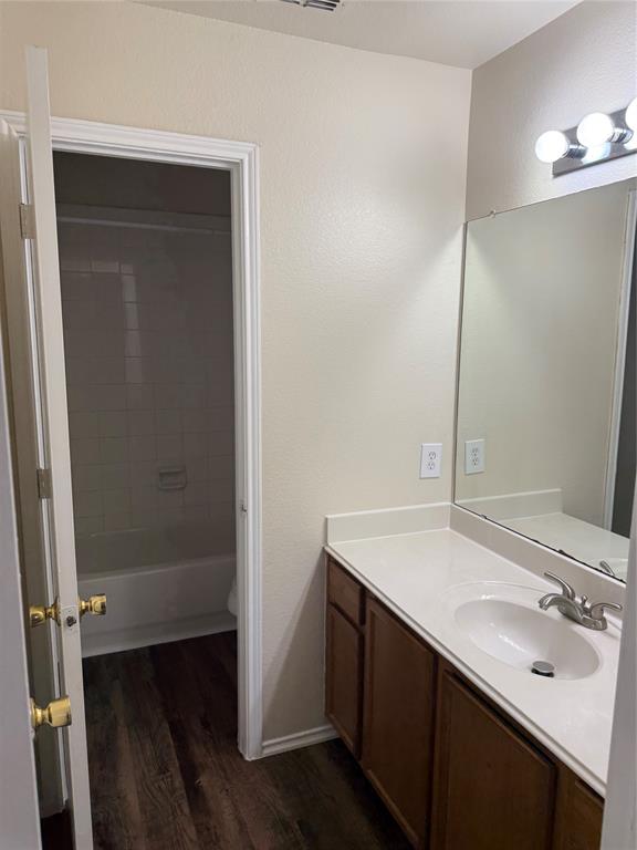 4116 Majestic Court Fort Worth, TX 76244 - Photo 37 of 37 a bathroom with a sink and a mirror