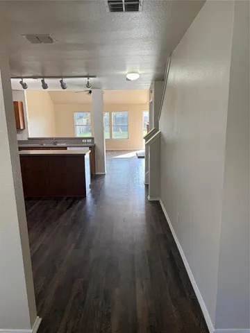 a view of kitchen with wooden floor