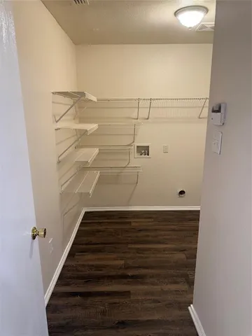 a view of a room with racks on the wall