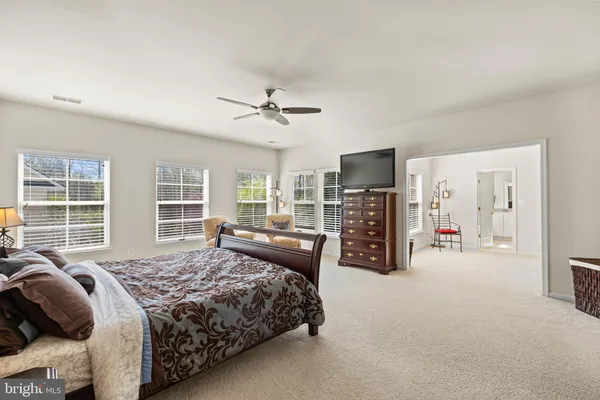a bedroom with a bed and a table