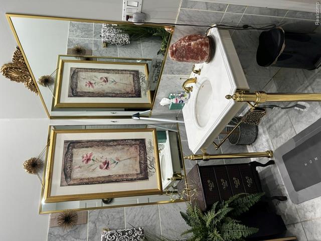 89 Muir Road Grosse Pointe, MI 48236 - Photo 3 of 29 Pedestal vanity with an integrated basin, brass-finish legs, and a coordinating brass-finish faucet