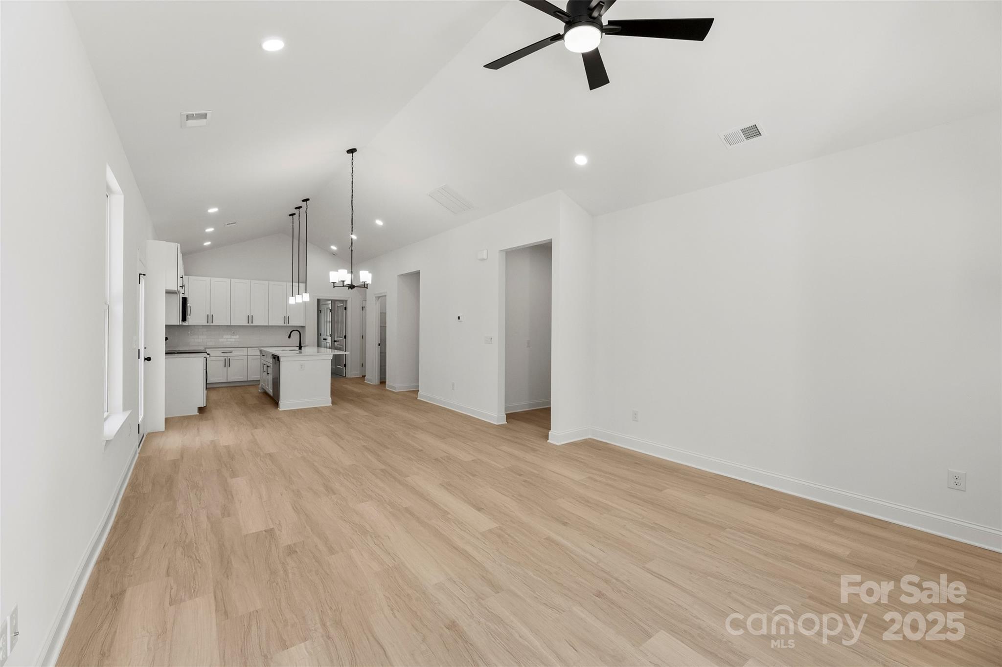 90 Sumner Avenue Northwest Concord, NC 28027 - Photo 11 of 40 a view of a kitchen with a sink and a refrigerator