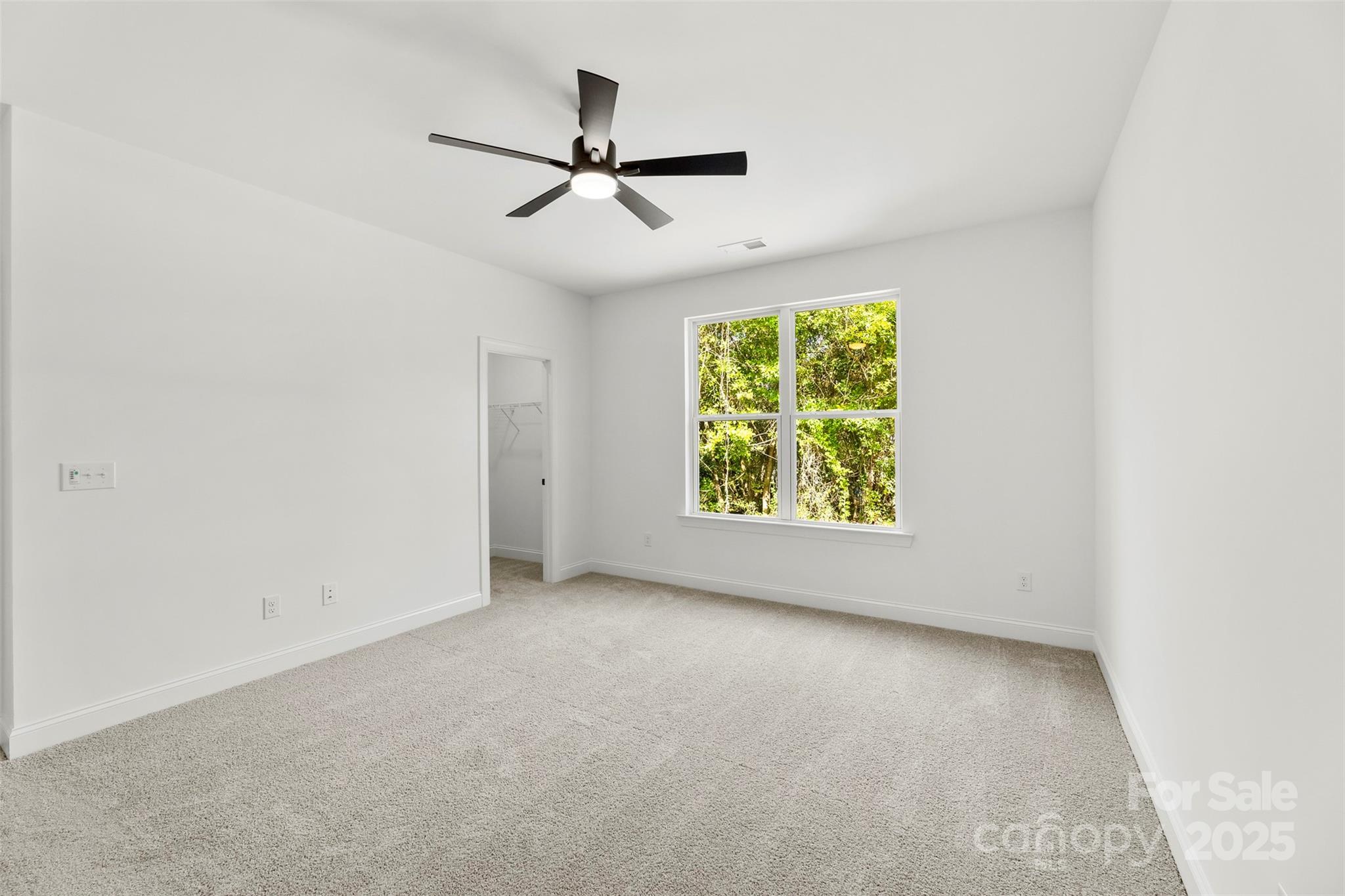 90 Sumner Avenue Northwest Concord, NC 28027 - Photo 17 of 40 an empty room with windows and ceiling fan