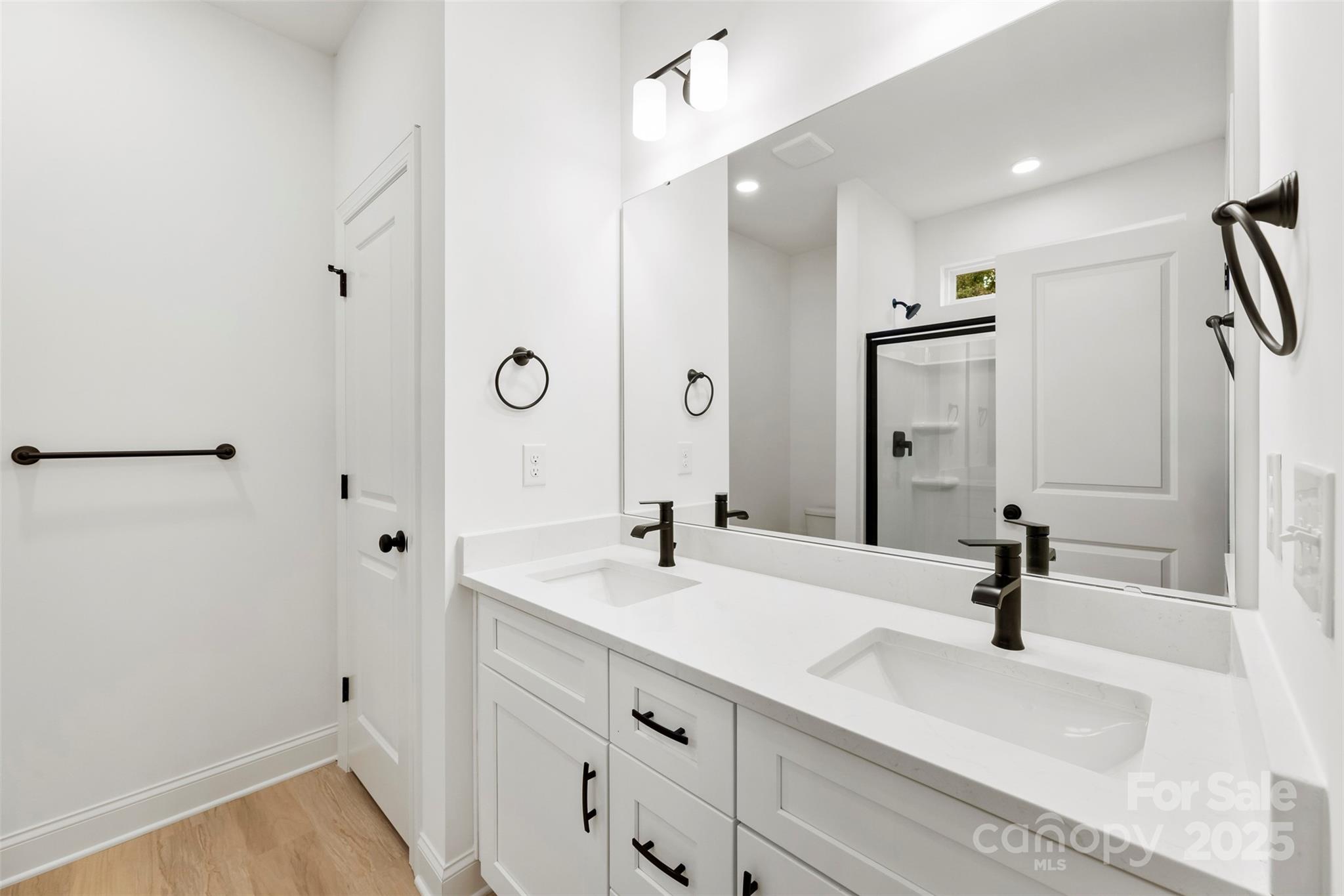 90 Sumner Avenue Northwest Concord, NC 28027 - Photo 20 of 40 a bathroom with double vanity sink and a mirror