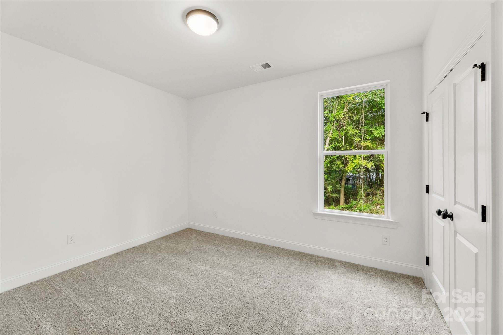 90 Sumner Avenue Northwest Concord, NC 28027 - Photo 22 of 40 an empty room with windows