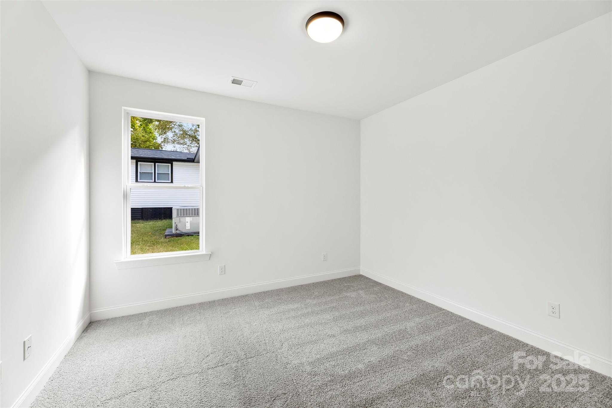 90 Sumner Avenue Northwest Concord, NC 28027 - Photo 28 of 40 a view of an empty room with a window