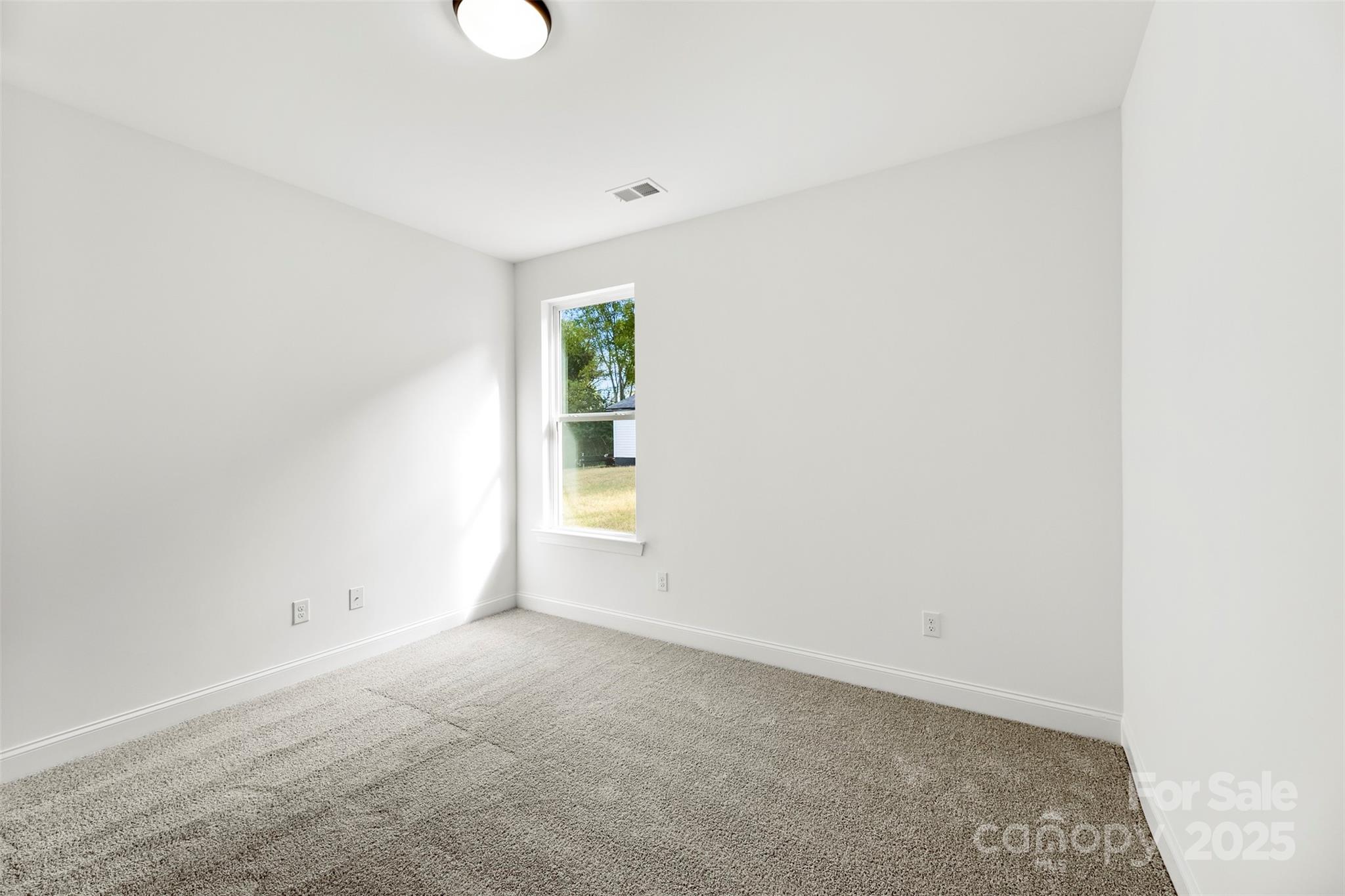 90 Sumner Avenue Northwest Concord, NC 28027 - Photo 29 of 40 a view of an empty room with a window