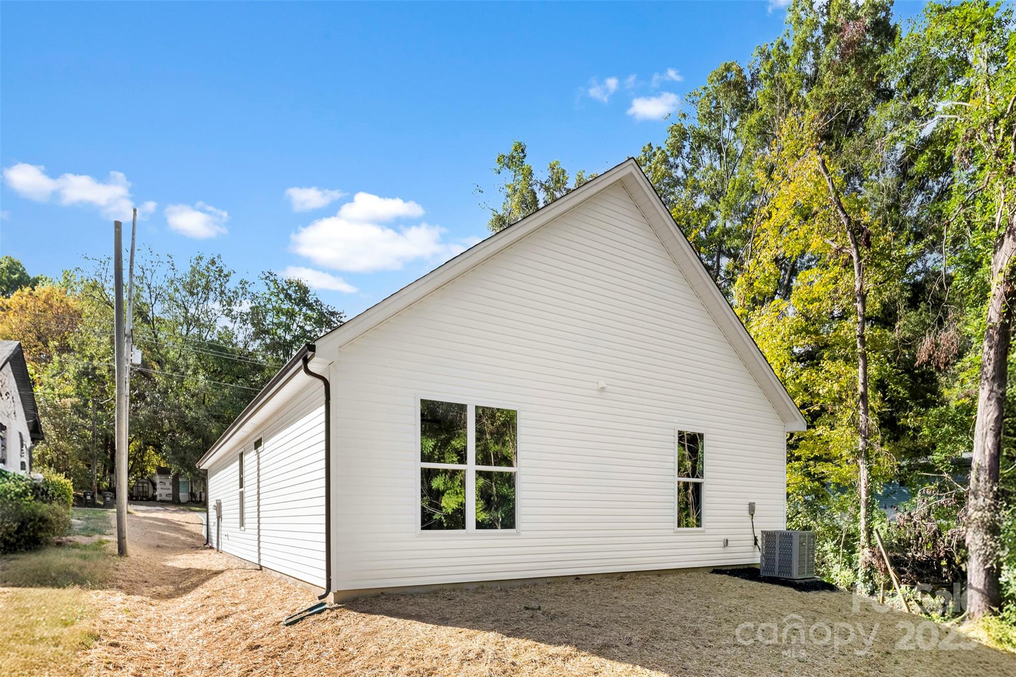 90 Sumner Avenue Northwest Concord, NC 28027 - Photo 36 of 40 a view of a house with a backyard