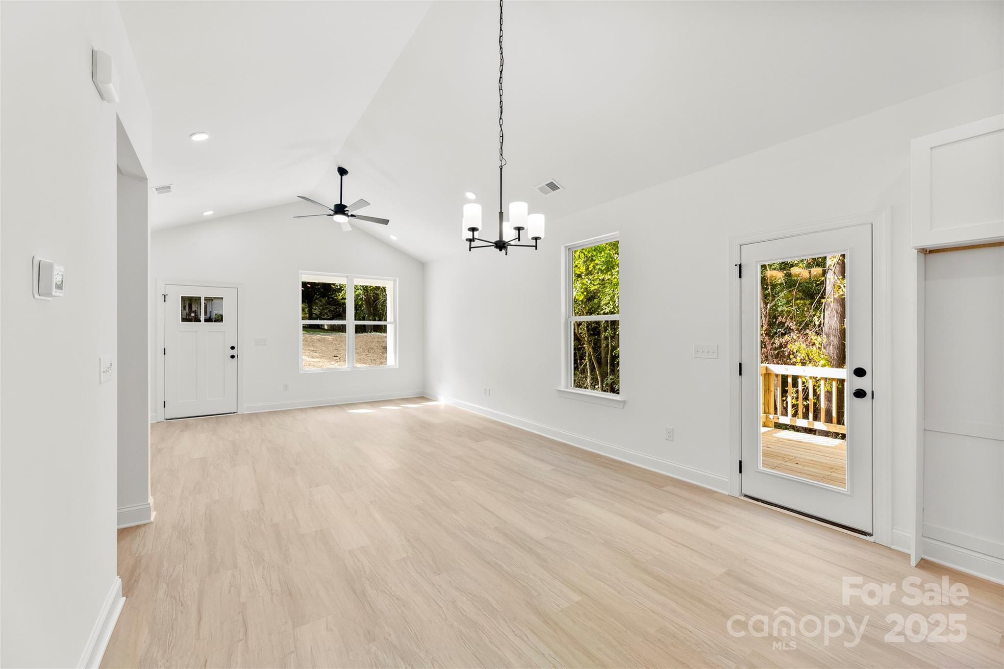 90 Sumner Avenue Northwest Concord, NC 28027 - Photo 8 of 40 a view of a room with wooden floor and windows