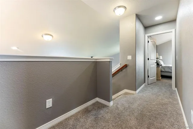 a view of a hallway with closet and entryway