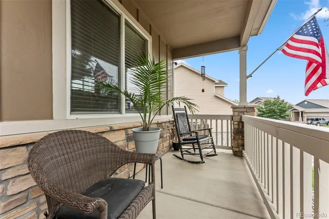 a balcony view with a seating space