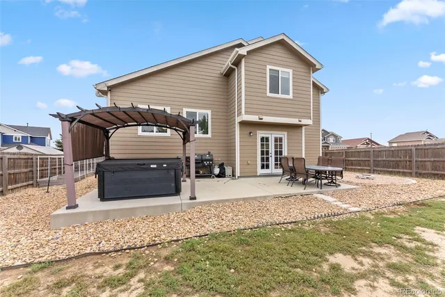 a view of a swimming pool with chair and table