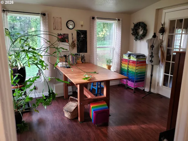 a view of a dining room with furniture window and wooden floor