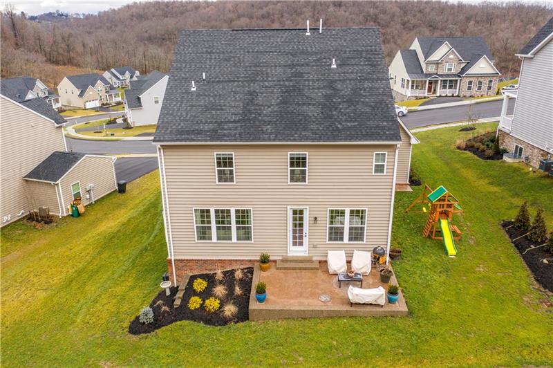 Back of the house. Beautiful landscaping and patio. 