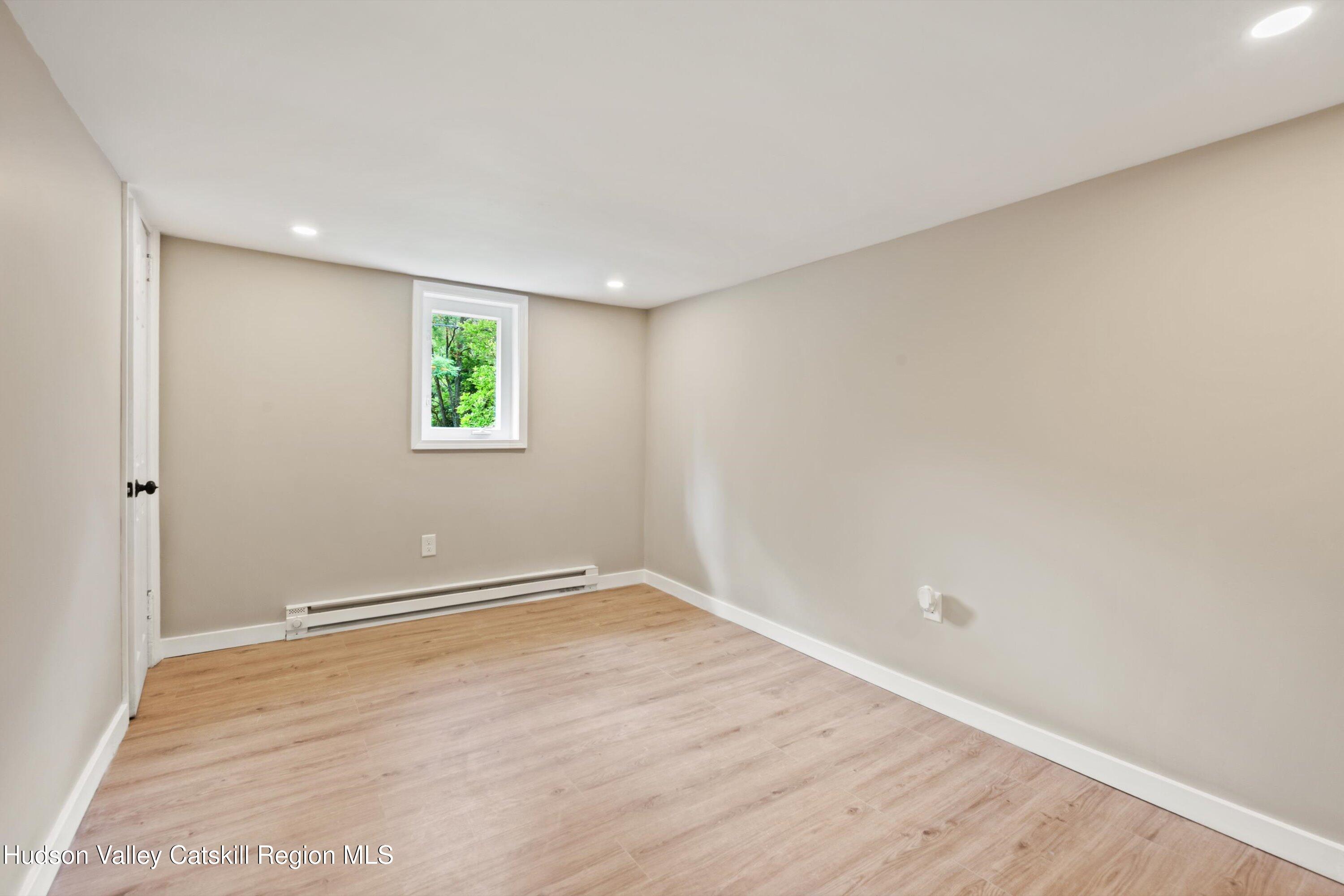 1320 Rudolph Weir Jr Road Earlton, NY 12058 - Photo 14 of 26 an empty room with windows and closet
