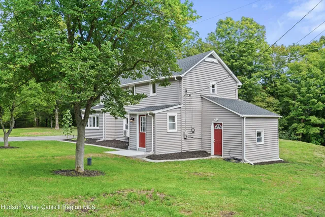 a view of a house with a yard