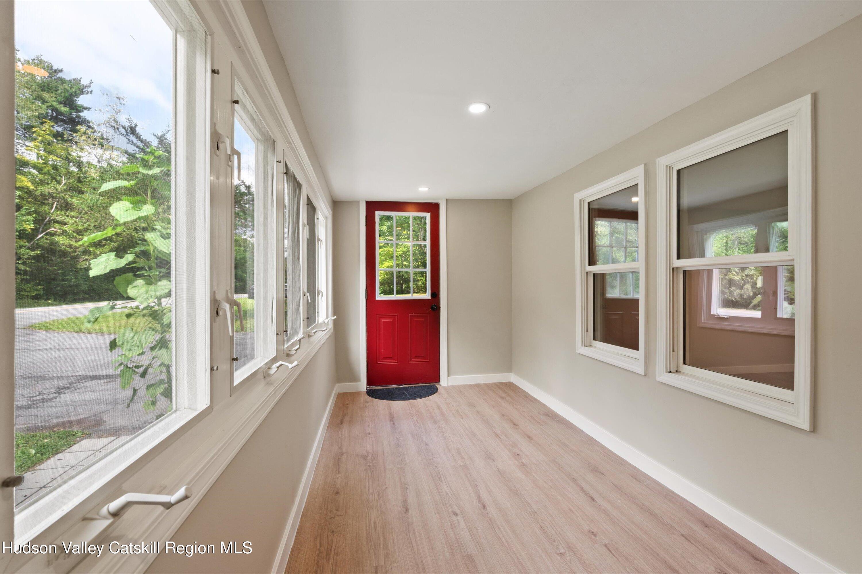 1320 Rudolph Weir Jr Road Earlton, NY 12058 - Photo 3 of 26 a view of an entryway with wooden floor and garden