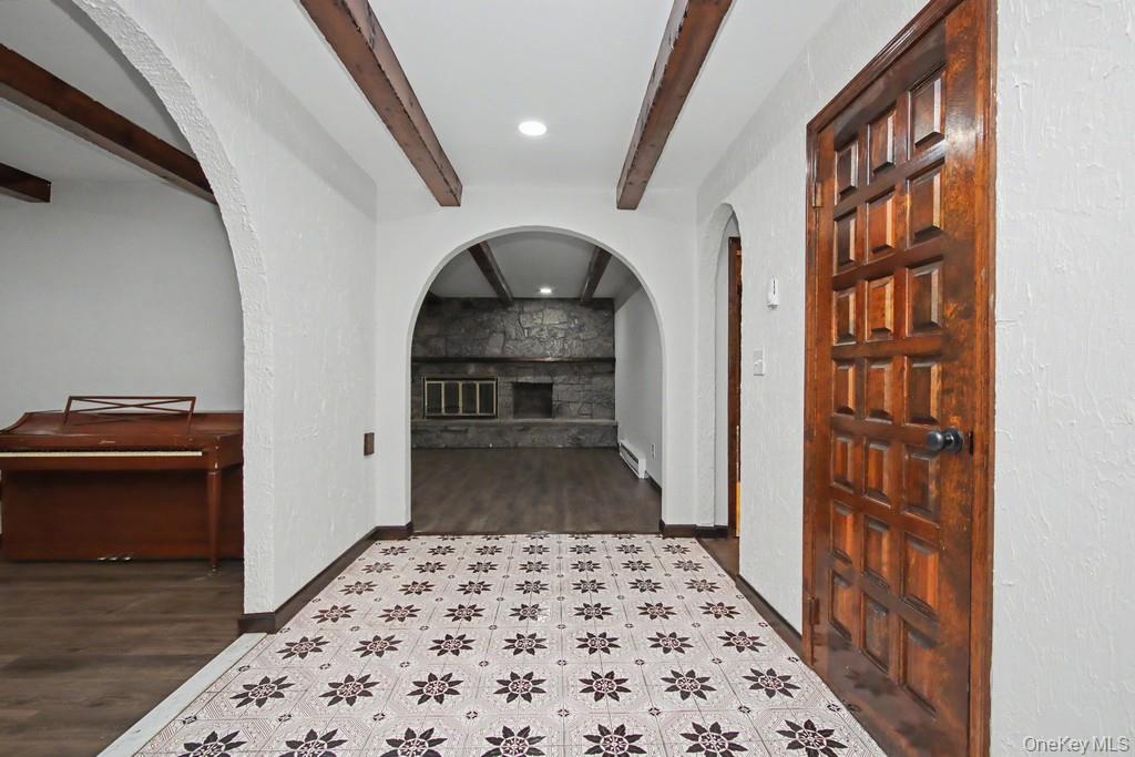 18 Hillside View Road Mahopac, NY 10541 - Photo 10 of 42 a hallway with a large windows and wooden floor