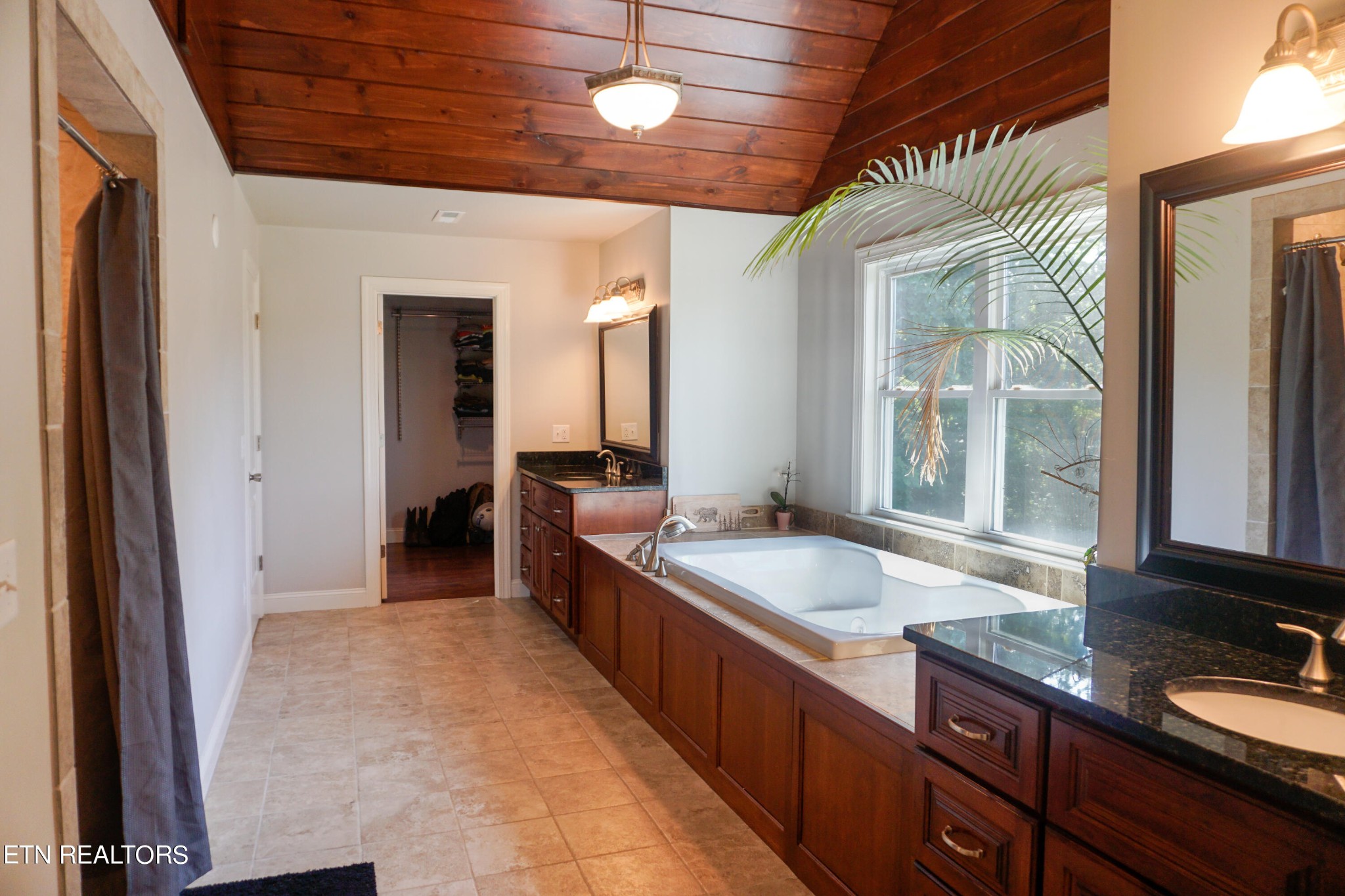 641 Plank Road Decatur, TN 37322 - Photo 16 of 32 a spacious bathroom with a granite countertop sink and a mirror