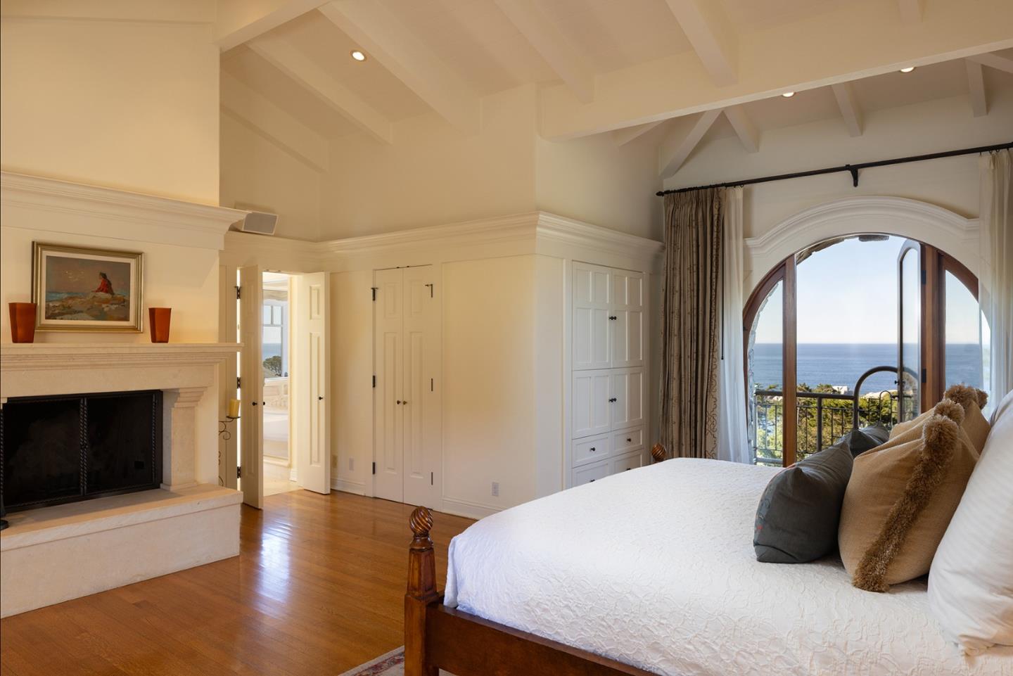 72 Fern Canyon Road Carmel, CA 93923 - Photo 25 of 66 a bedroom with a bed and a fireplace