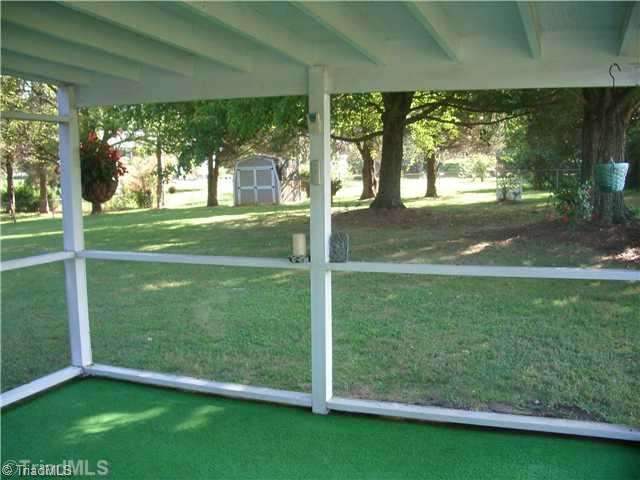 321 Stewart Road Southeast Winston-Salem, NC 27107 - Photo 4 of 8 Enclosed Porch. Wonderful screened porch overlooking private backyard perfect relaxing!